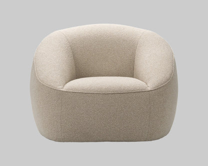 Beige armchair on a grey background